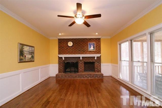 805 Thatcher Way Raleigh, NC 27615 - Photo 6 of 25 a view of an empty room with a fireplace and a window
