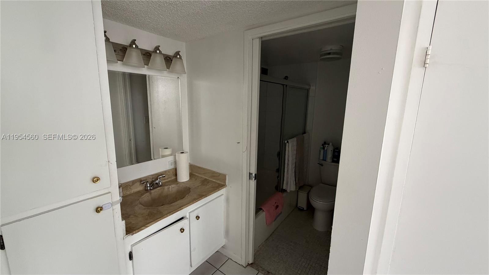 17011 North Bay Road, Unit 912 Sunny Isles Beach, FL 33160 - Photo 26 of 43 a en suite bathroom with a sink and mirror