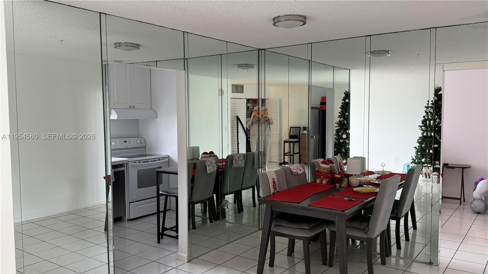 17011 North Bay Road, Unit 912 Sunny Isles Beach, FL 33160 - Photo 3 of 43 a view of a dining room with furniture