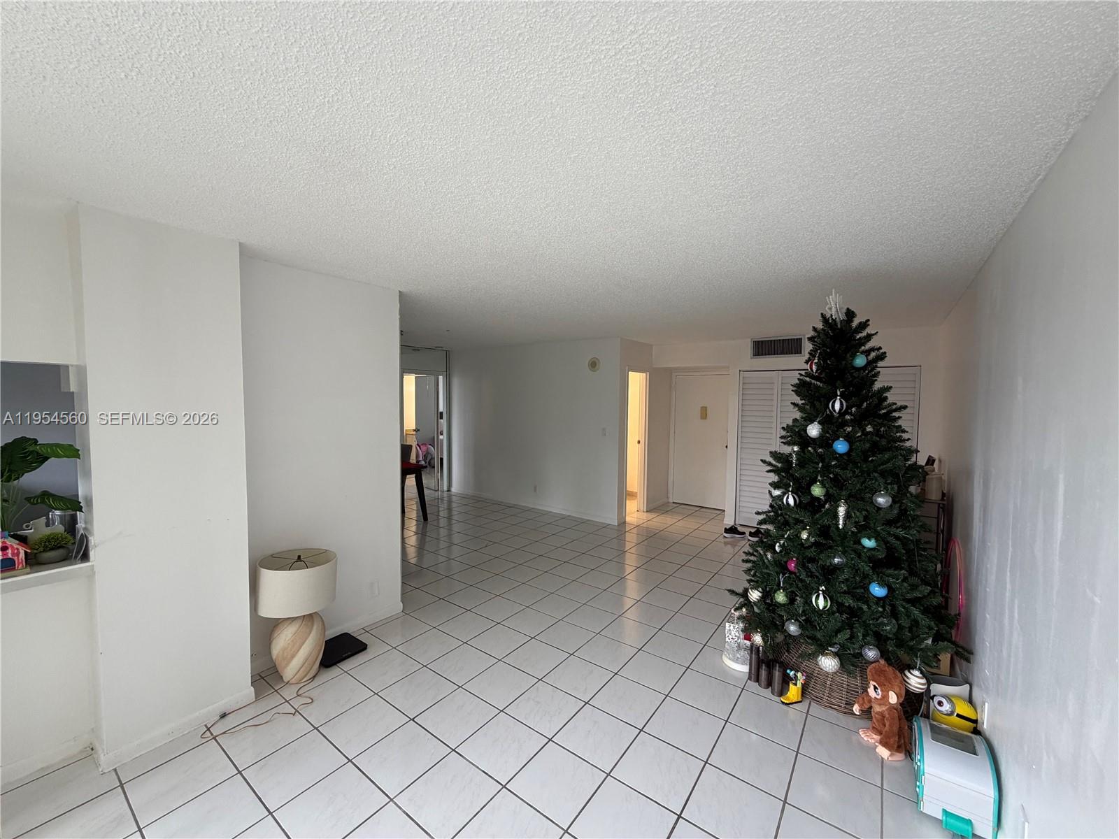 17011 North Bay Road, Unit 912 Sunny Isles Beach, FL 33160 - Photo 6 of 43 a view of a room with window and wooden floor