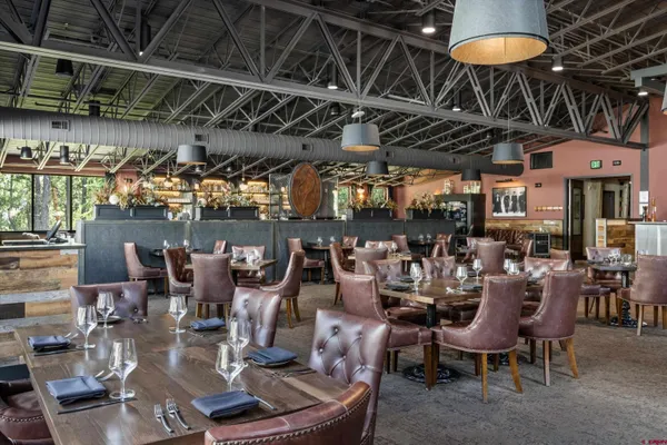 a room with lots of furniture and screen