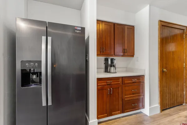 a bathroom with a shower and a sink