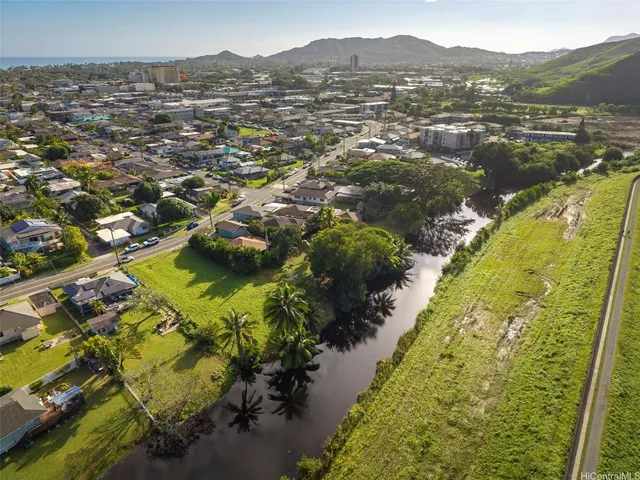 an aerial view of residential houses with outdoor space