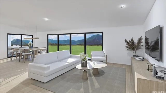 a living room with furniture a flat screen tv and a large window