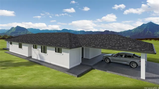 a car parked in front of a house with a yard