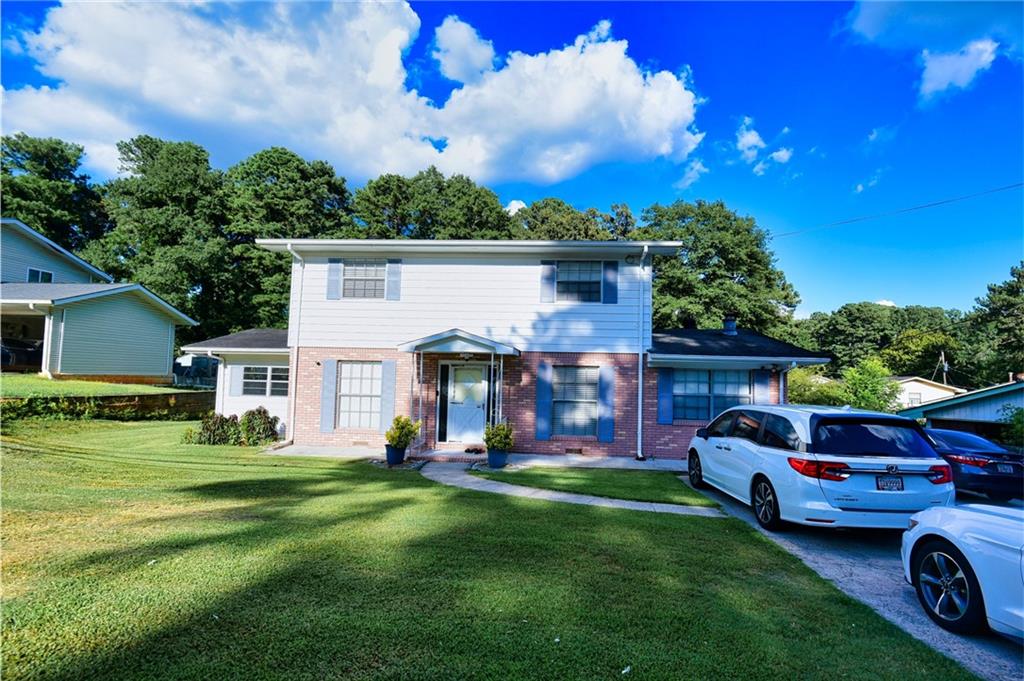 a front view of a house with garden