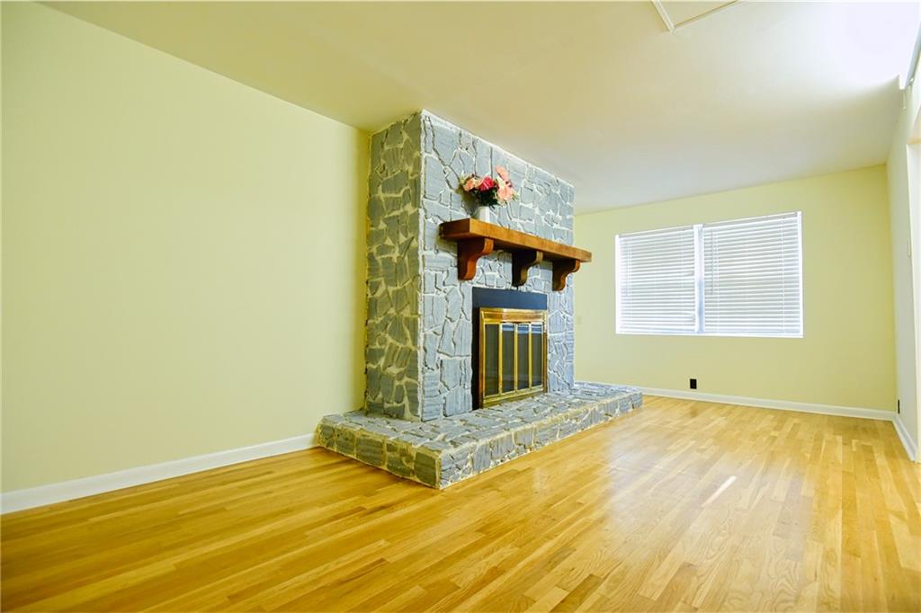 6418 Maddox Road Morrow, GA 30260 - Photo 13 of 30 a view of an empty room with window and a fireplace