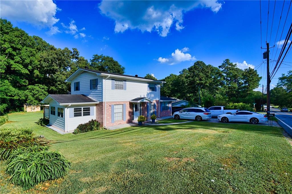 6418 Maddox Road Morrow, GA 30260 - Photo 2 of 30 a view of a house with a big yard