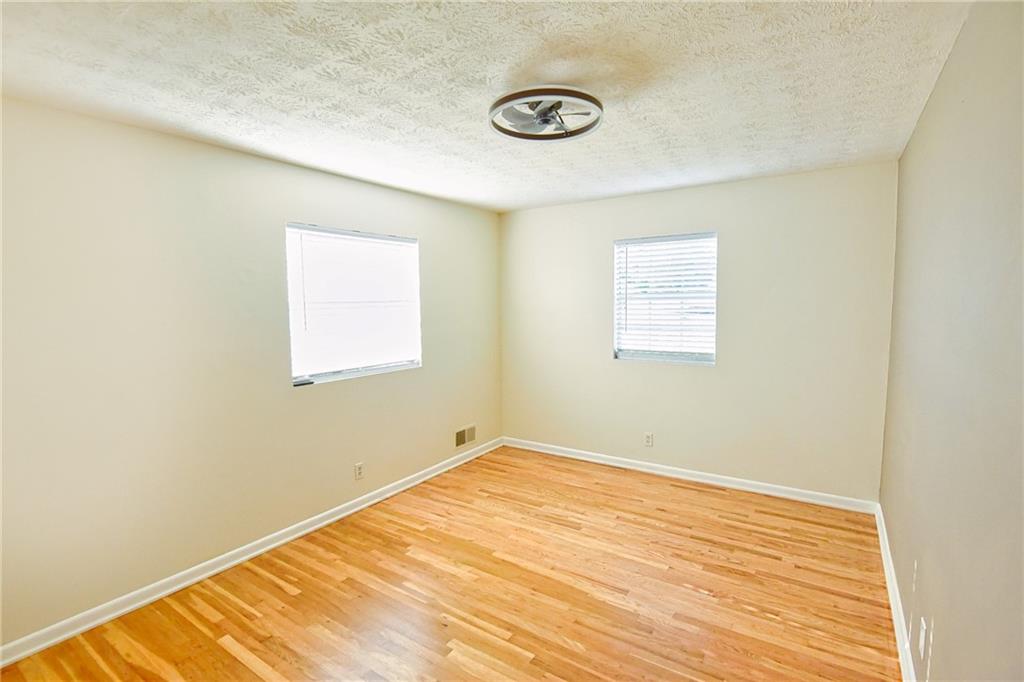 6418 Maddox Road Morrow, GA 30260 - Photo 24 of 30 a view of a room with wooden floor and white walls