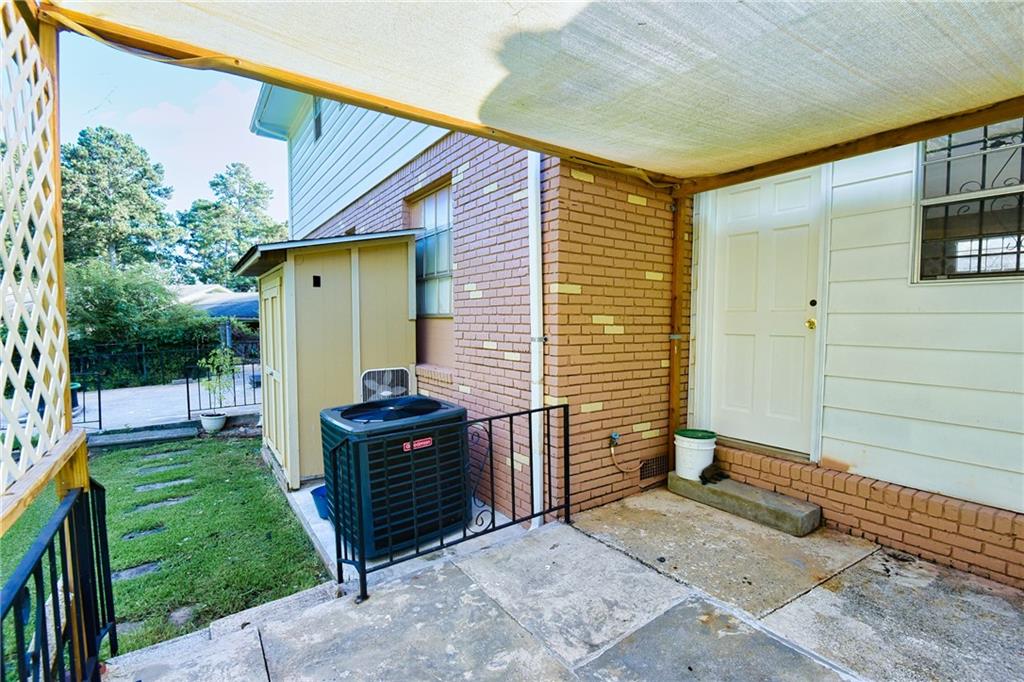 6418 Maddox Road Morrow, GA 30260 - Photo 28 of 30 a backyard of a house with barbeque oven
