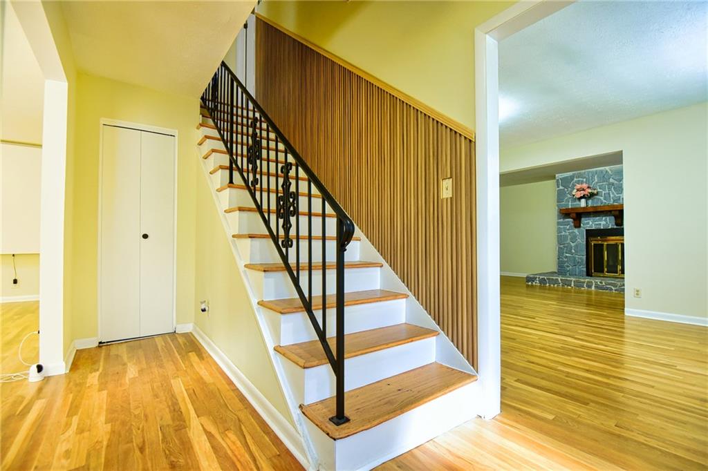 6418 Maddox Road Morrow, GA 30260 - Photo 4 of 30 a view of a hallway with wooden floor and staircase