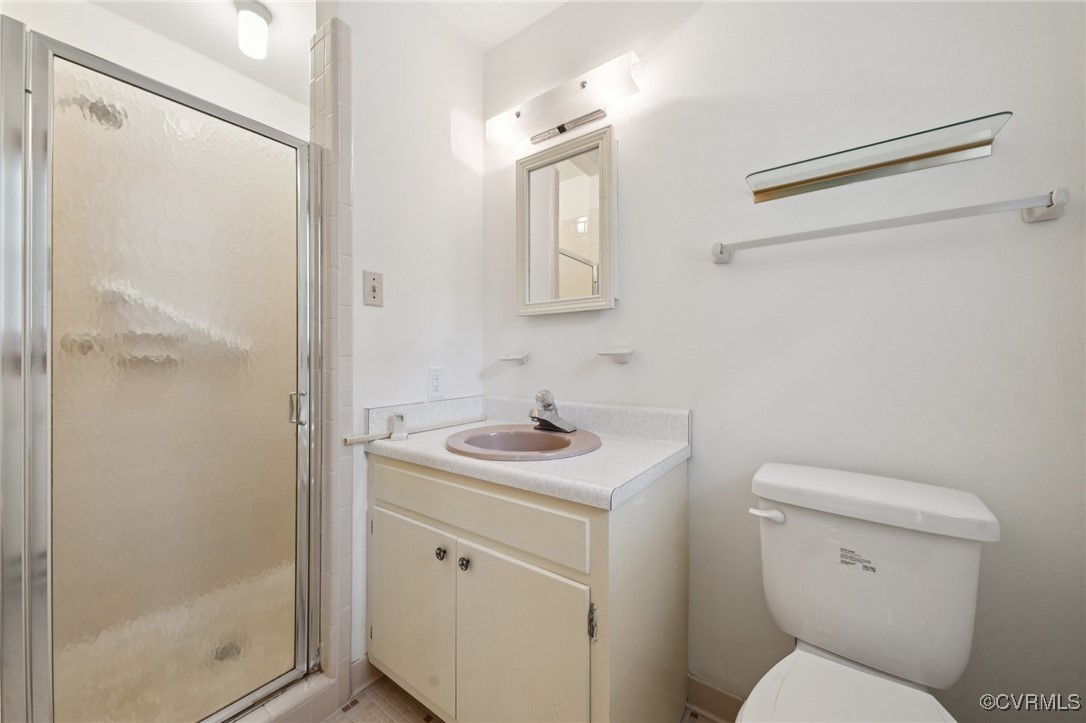8410 Beach Road Chesterfield, VA 23838 - Photo 13 of 22 a bathroom with a toilet sink and shower