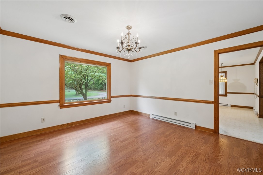 8410 Beach Road Chesterfield, VA 23838 - Photo 8 of 22 an empty room with wooden floor and windows