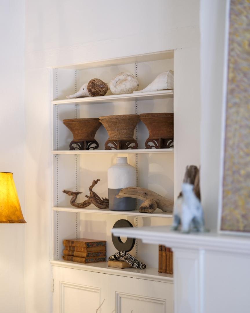 150 Littlefield Road Monterey, CA 93940 - Photo 41 of 51 a shelf with a vase of flowers