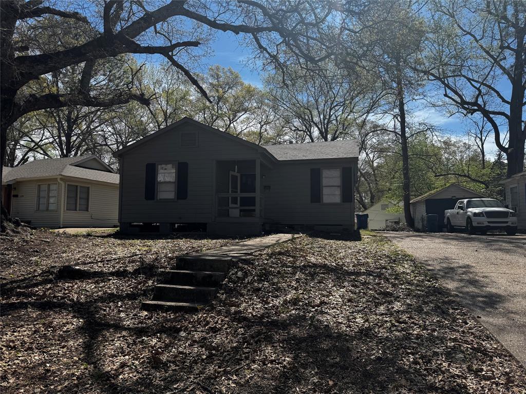 1004 Tillman Drive Minden, LA 71055 - Photo 1 of 1 a front view of a house with a yard