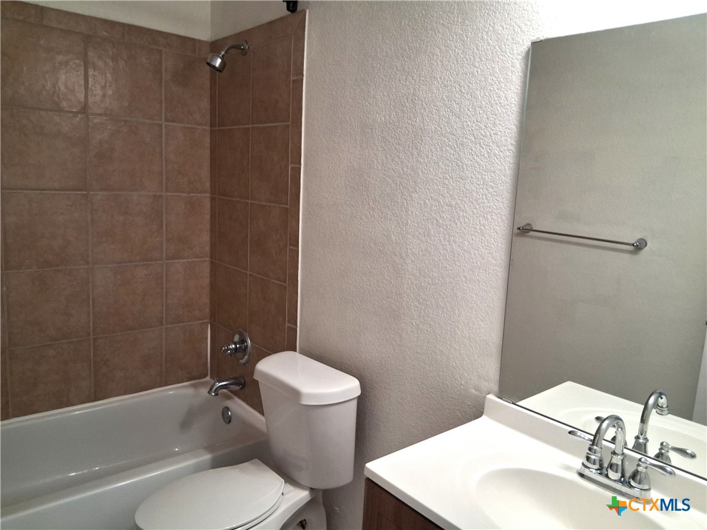 5605 Bald Ridge Court Killeen, TX 76542 - Photo 14 of 17 a bathroom with a sink toilet and shower