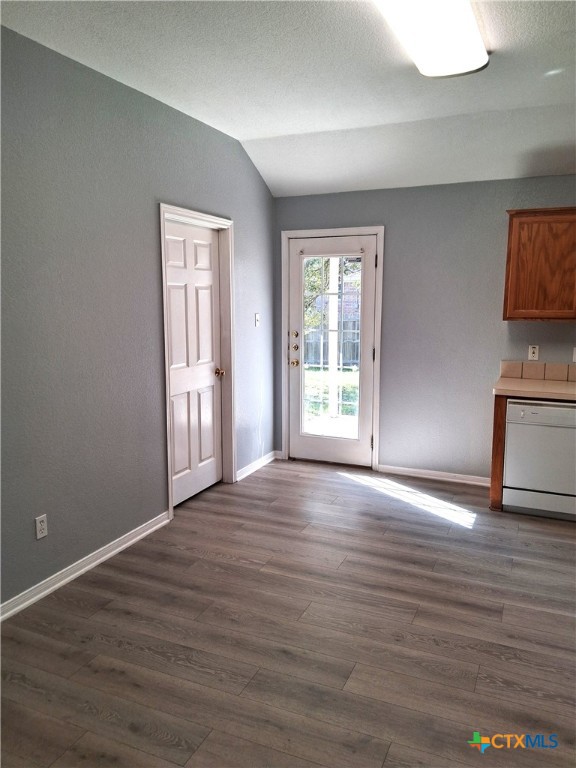 5605 Bald Ridge Court Killeen, TX 76542 - Photo 8 of 17 a view of an empty room with wooden floor and a window
