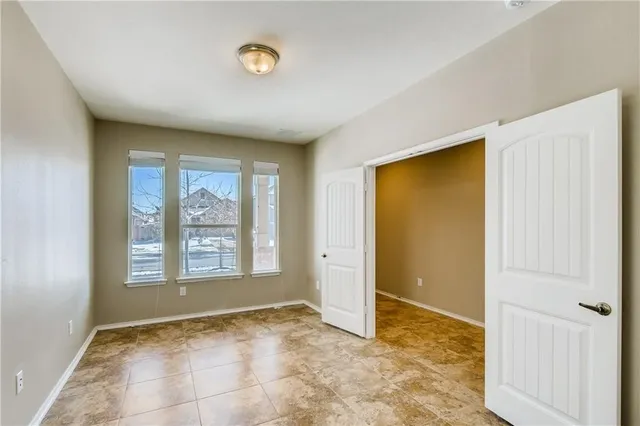 a view of an empty room with a window
