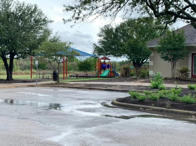 a view of a garden and swimming pool