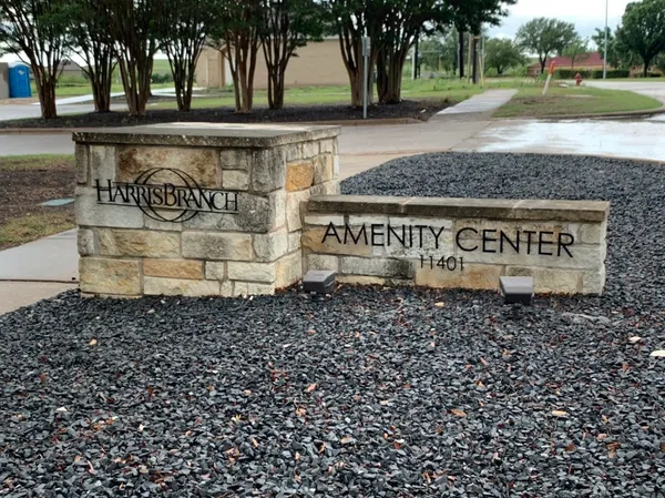 a view of a park with iron fence