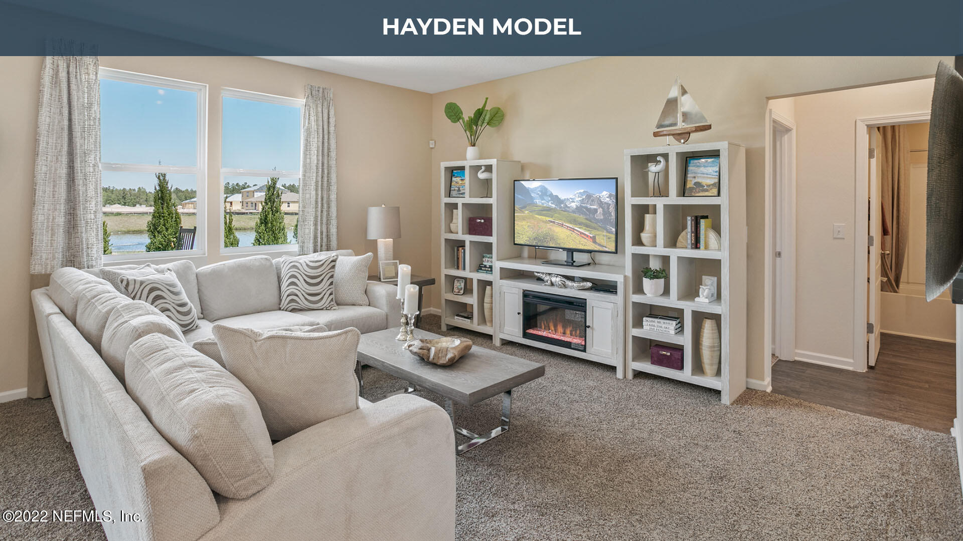 187 Encanto Way Street St. Augustine, FL 32084 - Photo 8 of 47 a living room with furniture a fireplace and a flat screen tv