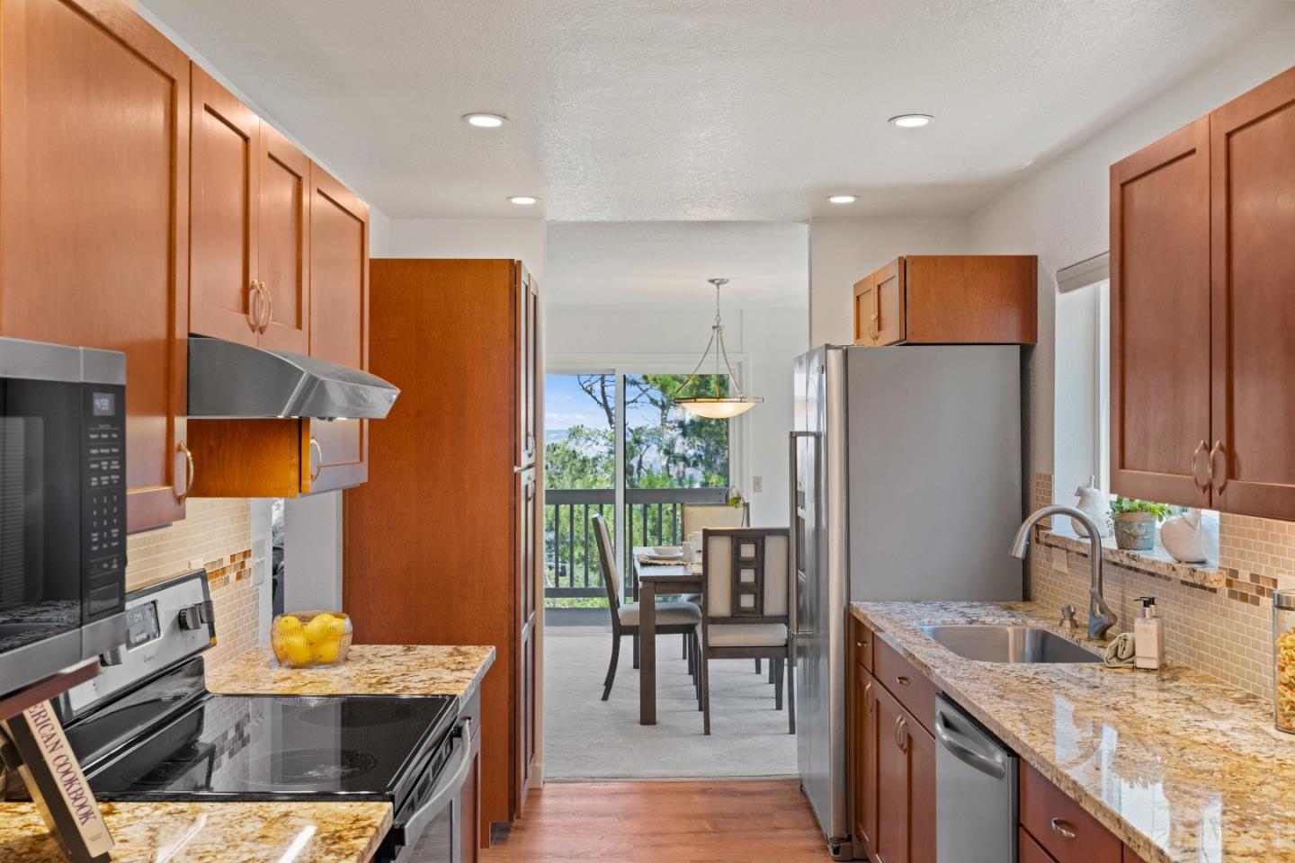 43 Shepherd's Knoll Pebble Beach, CA 93953 - Photo 12 of 34 a kitchen with stainless steel appliances granite countertop a sink stove and refrigerator