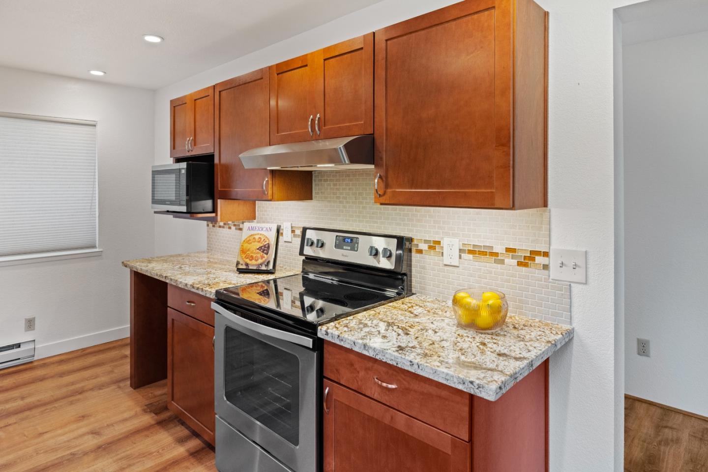43 Shepherd's Knoll Pebble Beach, CA 93953 - Photo 15 of 34 a kitchen with a sink a stove and cabinets