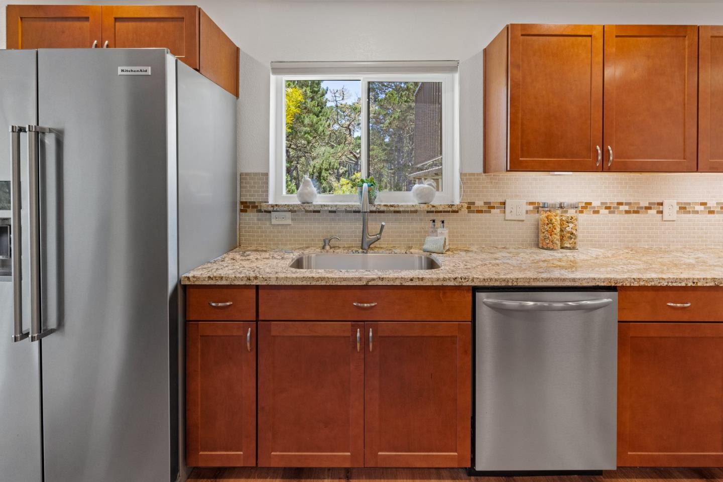 43 Shepherd's Knoll Pebble Beach, CA 93953 - Photo 16 of 34 a sink with granite countertop cabinets and window