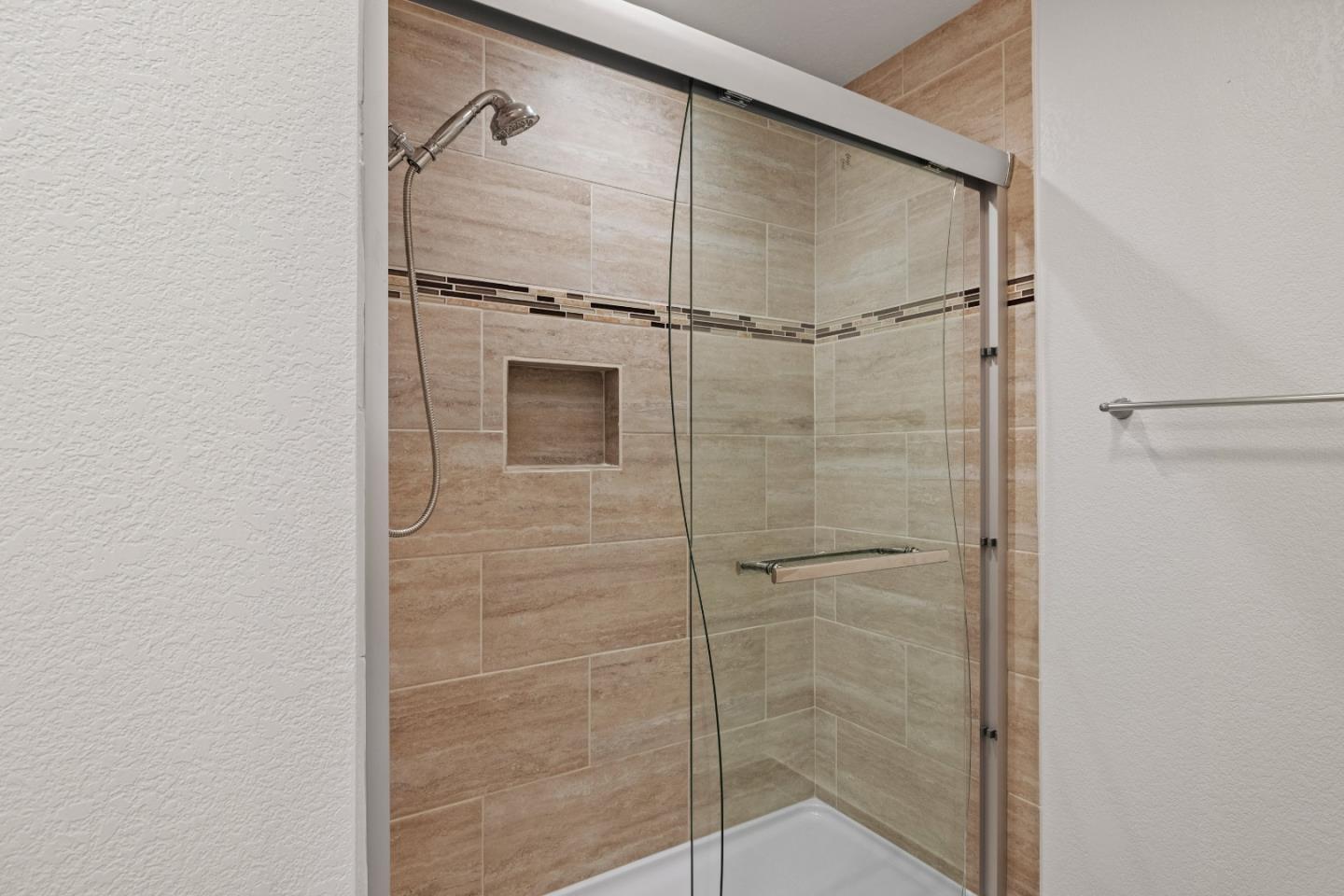 43 Shepherd's Knoll Pebble Beach, CA 93953 - Photo 25 of 34 a bathroom with a shower and a glass door
