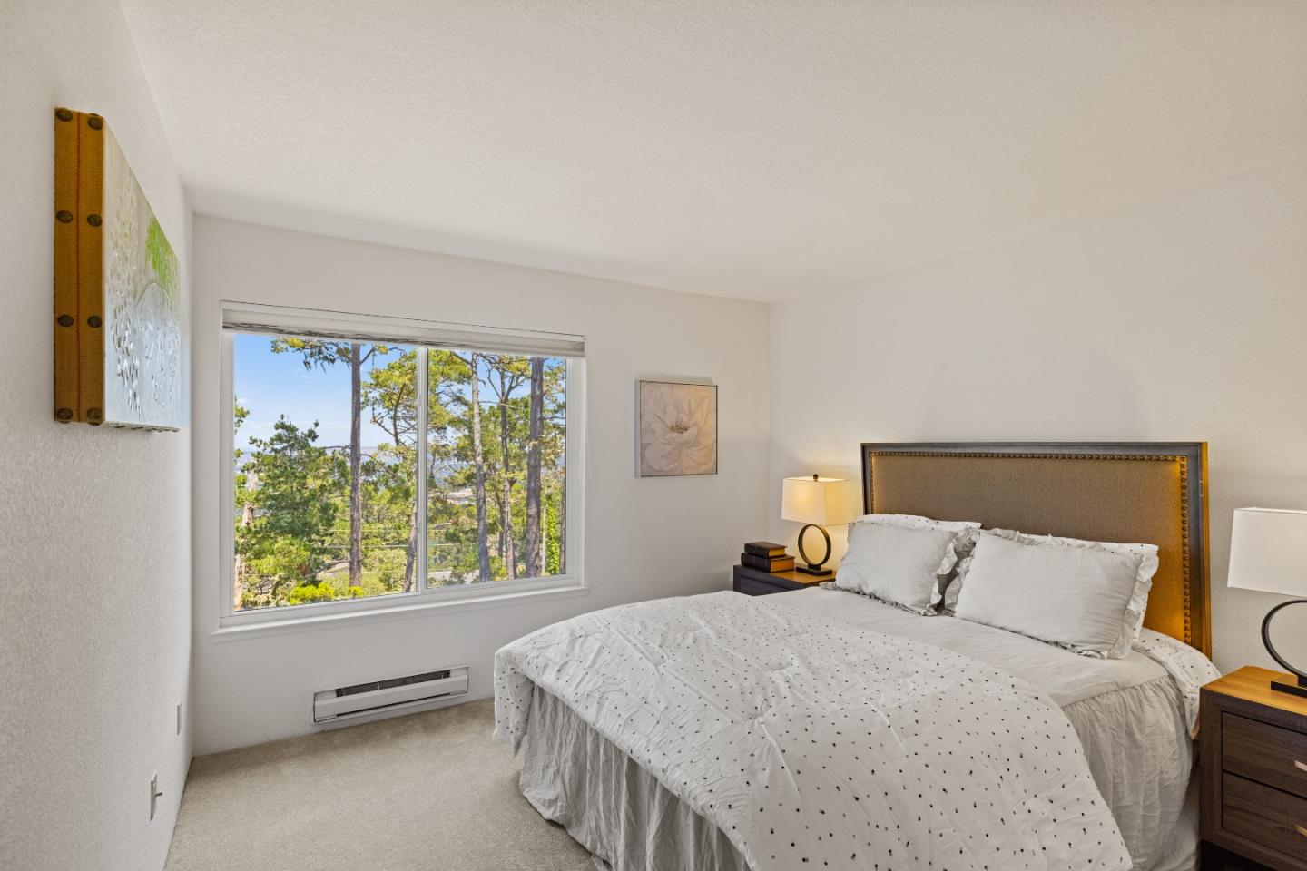 43 Shepherd's Knoll Pebble Beach, CA 93953 - Photo 26 of 34 a bedroom with a large bed and a window