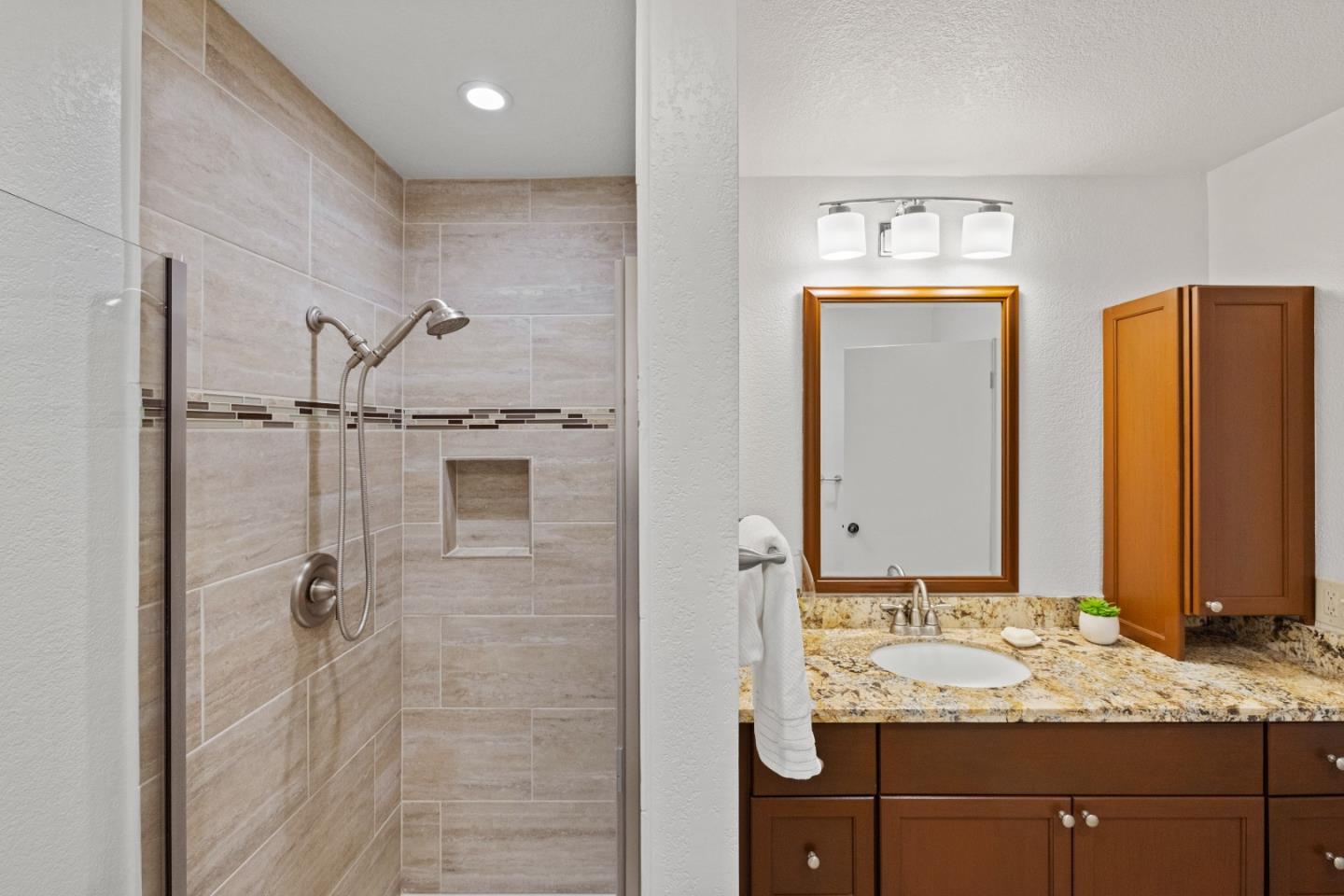43 Shepherd's Knoll Pebble Beach, CA 93953 - Photo 29 of 34 a bathroom with a granite countertop sink and a mirror