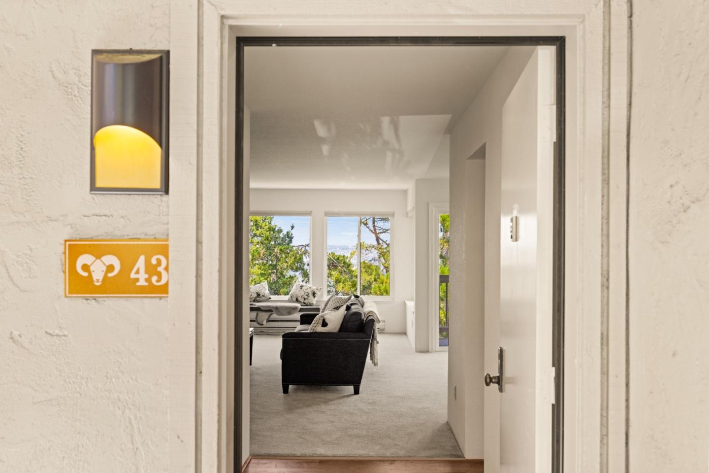 43 Shepherd's Knoll Pebble Beach, CA 93953 - Photo 32 of 34 a view of a hallway with couch and a potted plant