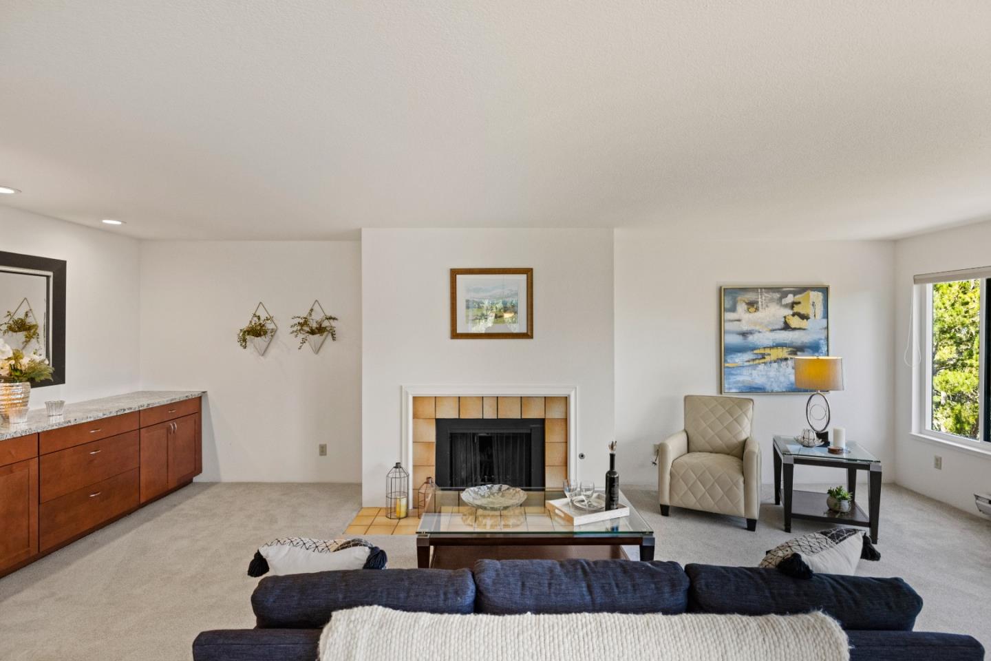 43 Shepherd's Knoll Pebble Beach, CA 93953 - Photo 8 of 34 a living room with furniture a fireplace and a window