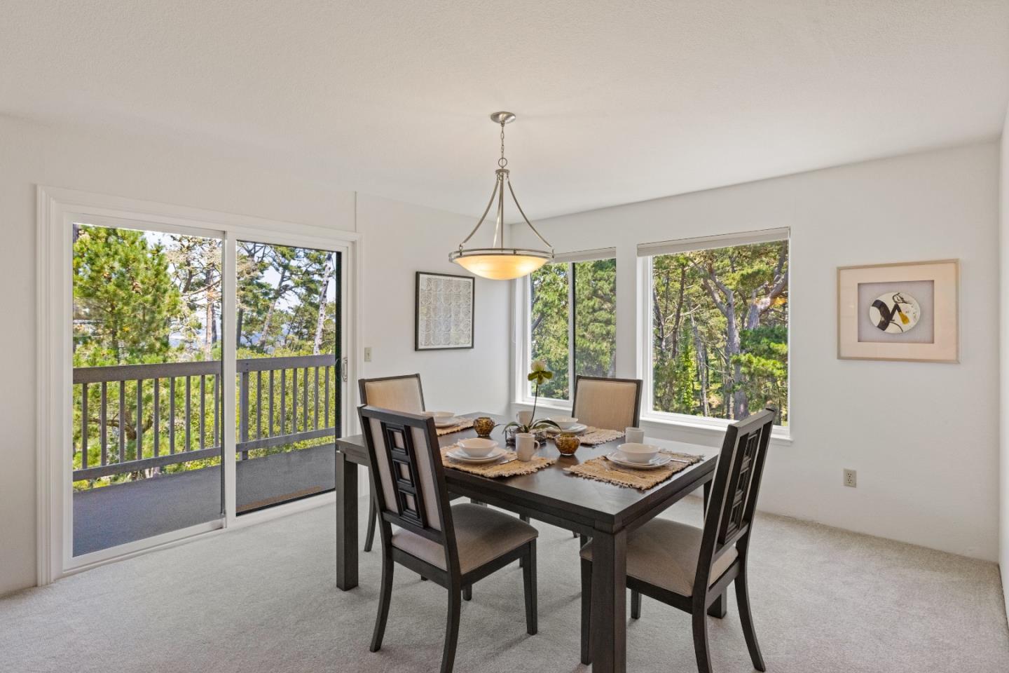 43 Shepherd's Knoll Pebble Beach, CA 93953 - Photo 9 of 34 a dining room with furniture a chandelier and wooden floor