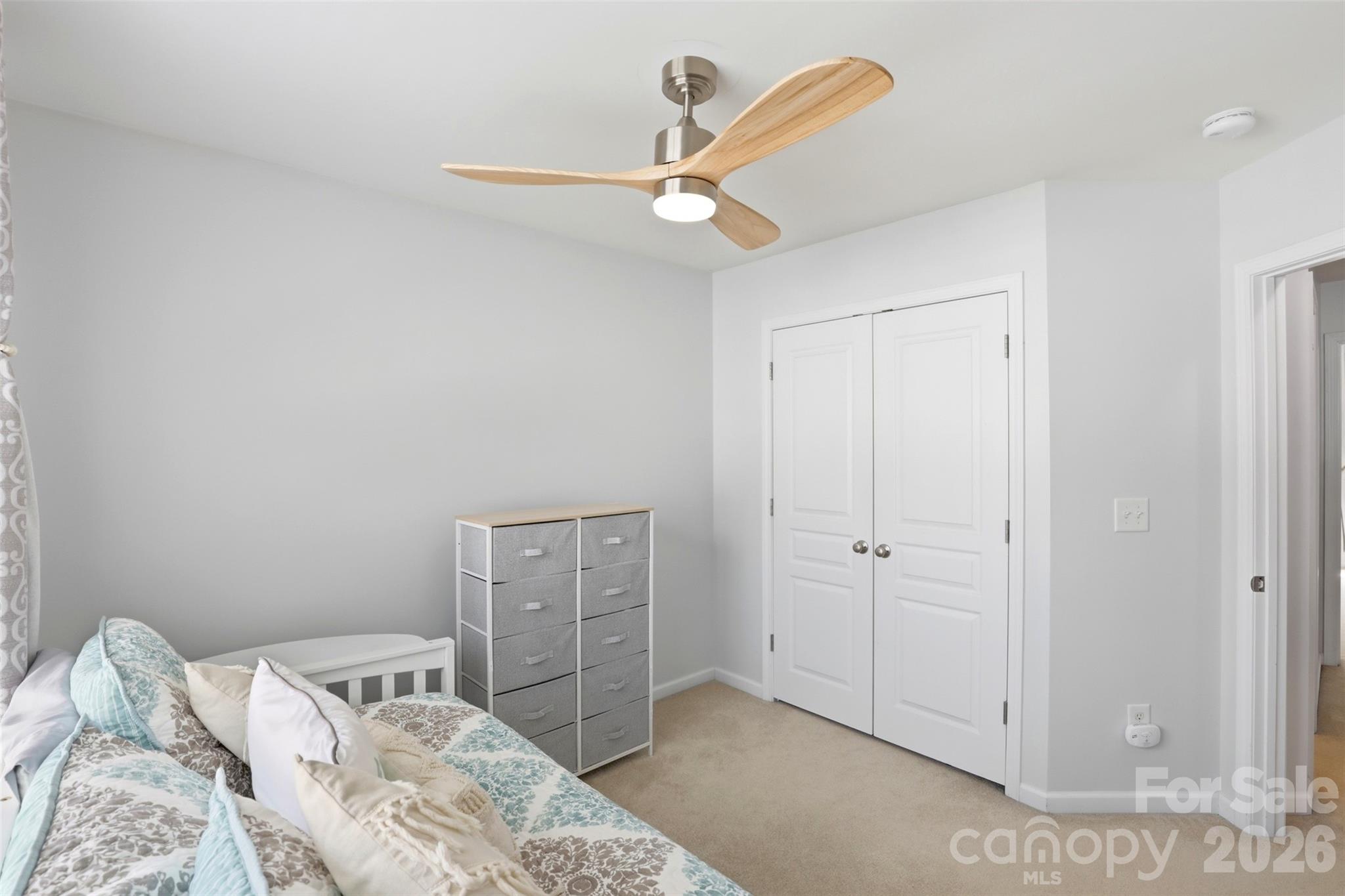 532 Bent Leaf Court Fort Mill, SC 29708 - Photo 21 of 27 a bedroom with a bed and a ceiling fan