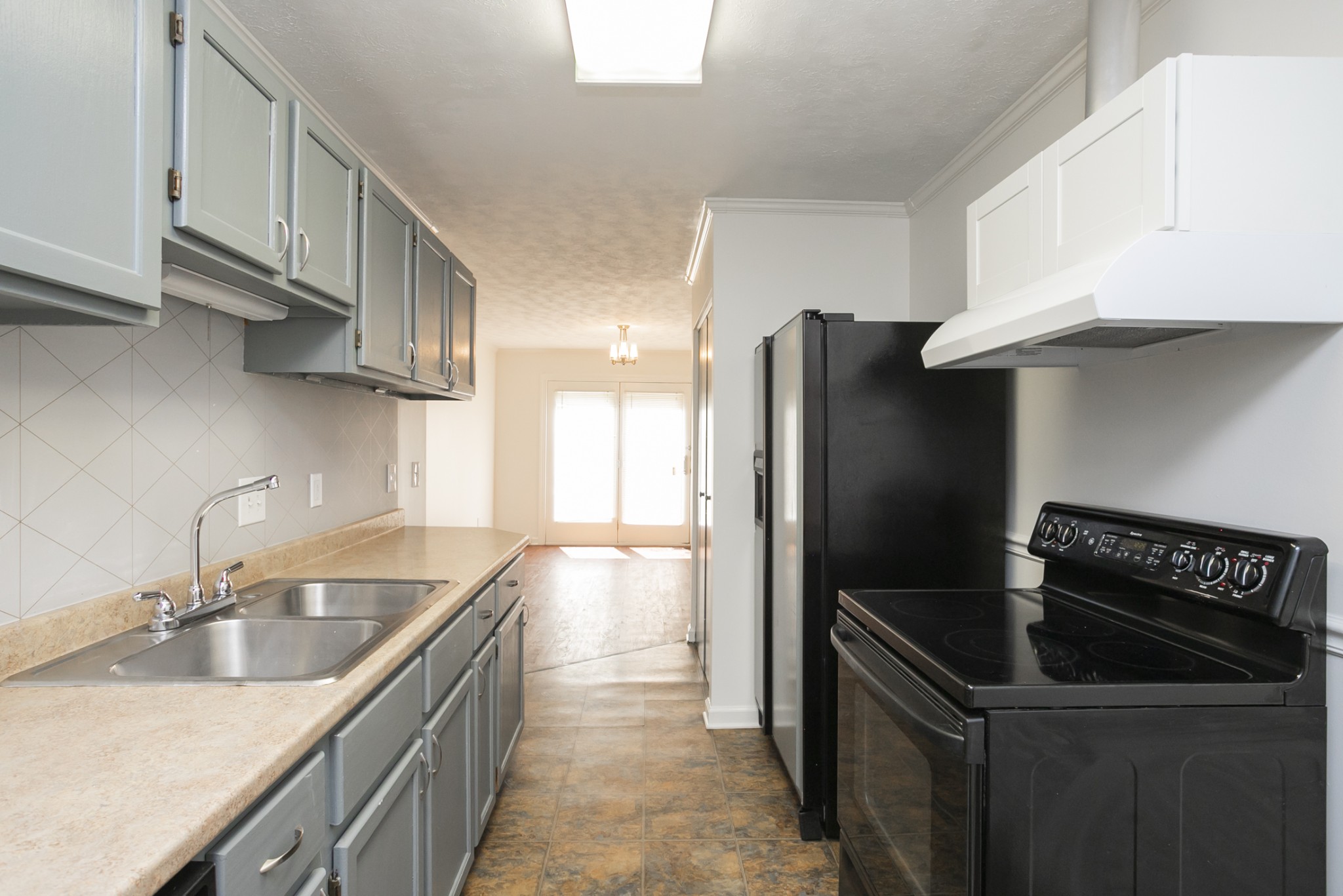 1720 Hanover Road, Unit B Nashville, TN 37216 - Photo 15 of 25 a kitchen with granite countertop a refrigerator and a sink