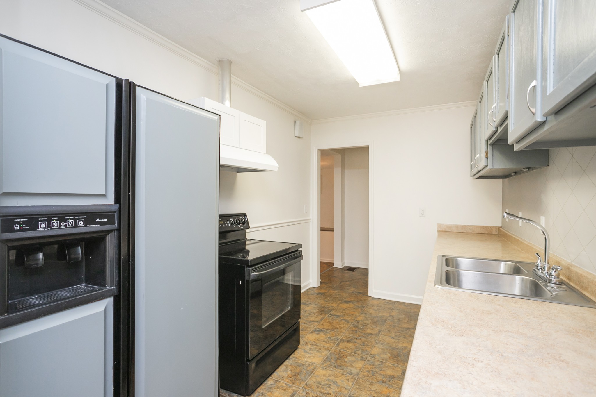 1720 Hanover Road, Unit B Nashville, TN 37216 - Photo 16 of 25 a kitchen with stainless steel appliances granite countertop a refrigerator and a stove