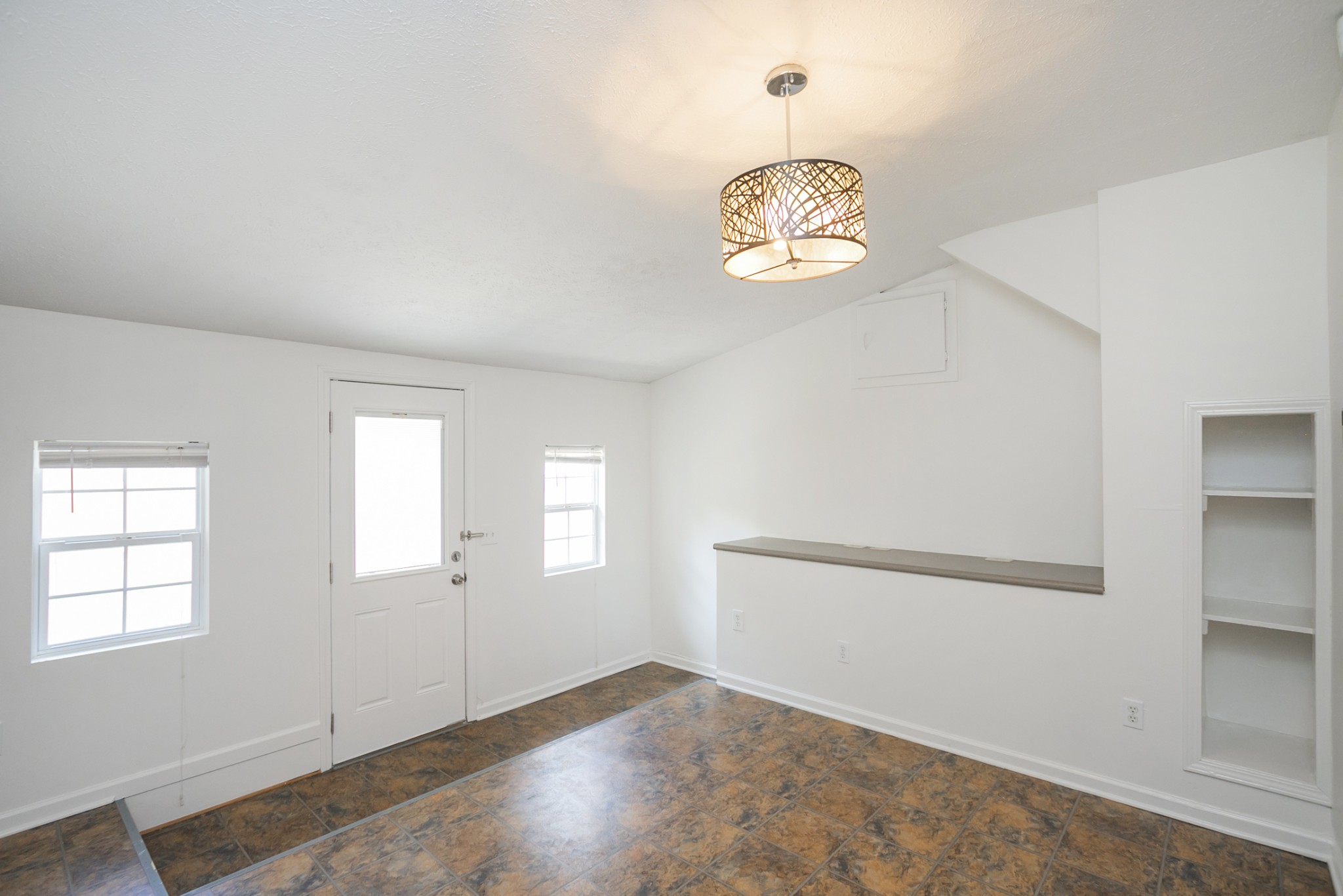 1720 Hanover Road, Unit B Nashville, TN 37216 - Photo 2 of 25 an empty room with windows and painted walls