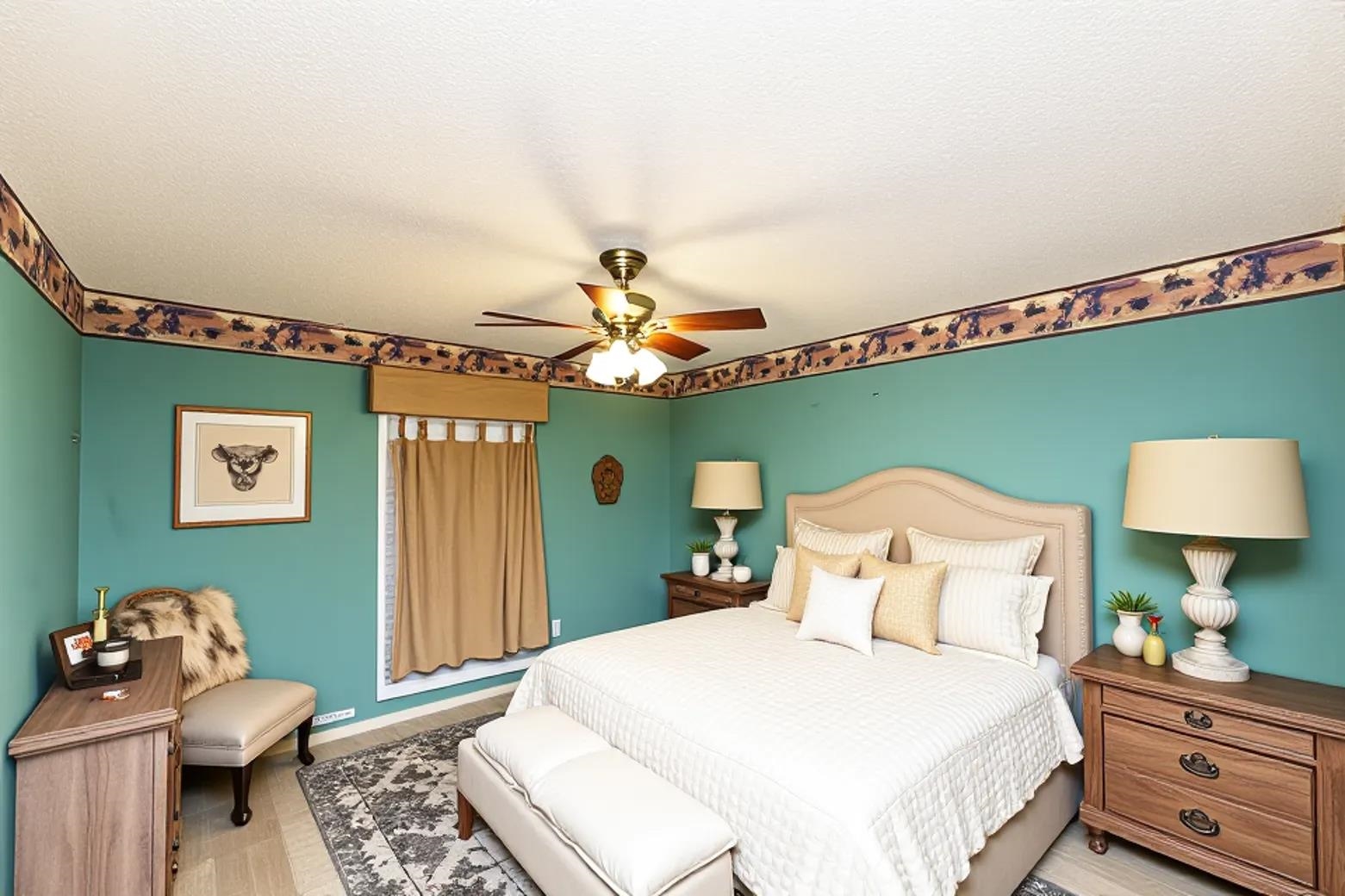 643 Fore Lane Mason, TN 38049 - Photo 16 of 40 a bedroom with a bed and a lamp on table