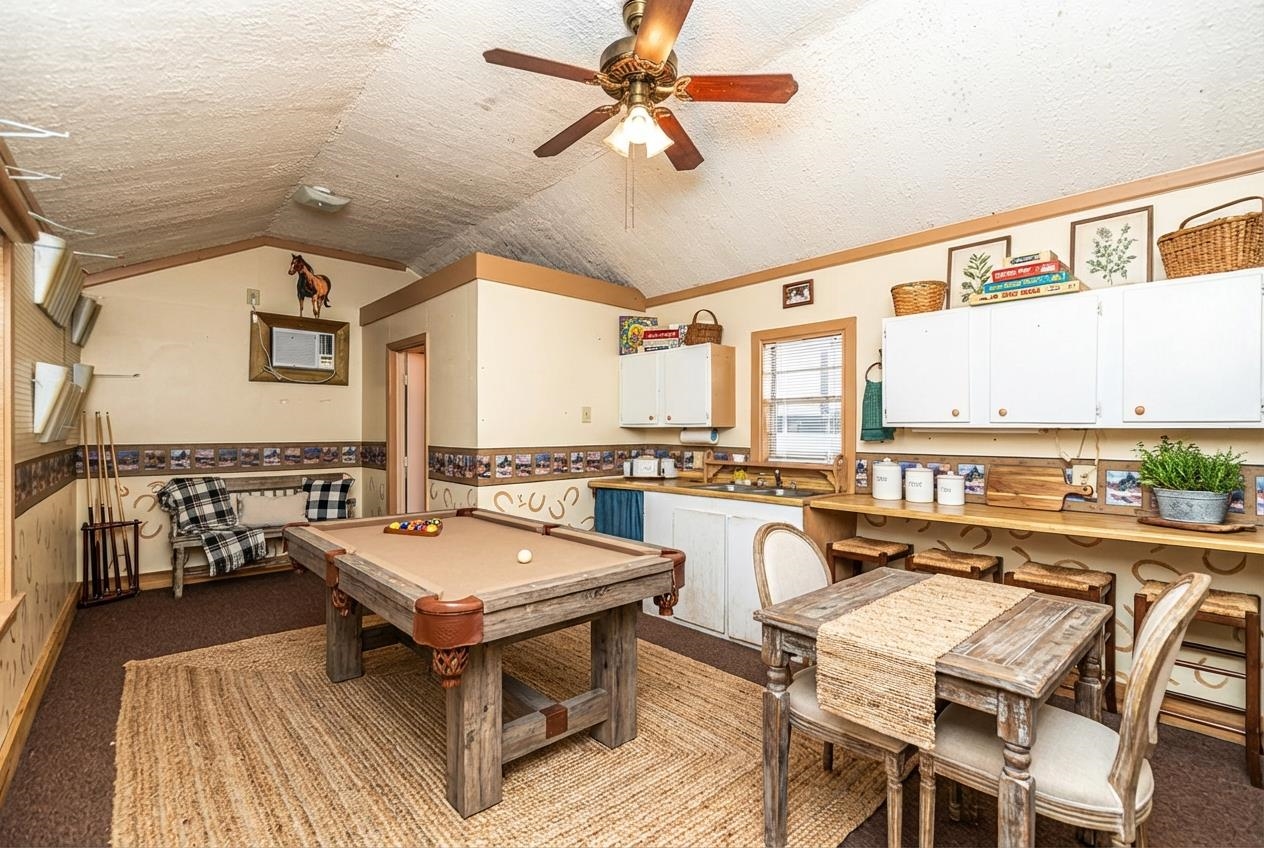 643 Fore Lane Mason, TN 38049 - Photo 21 of 40 a living room with furniture a rug and a floor to ceiling window