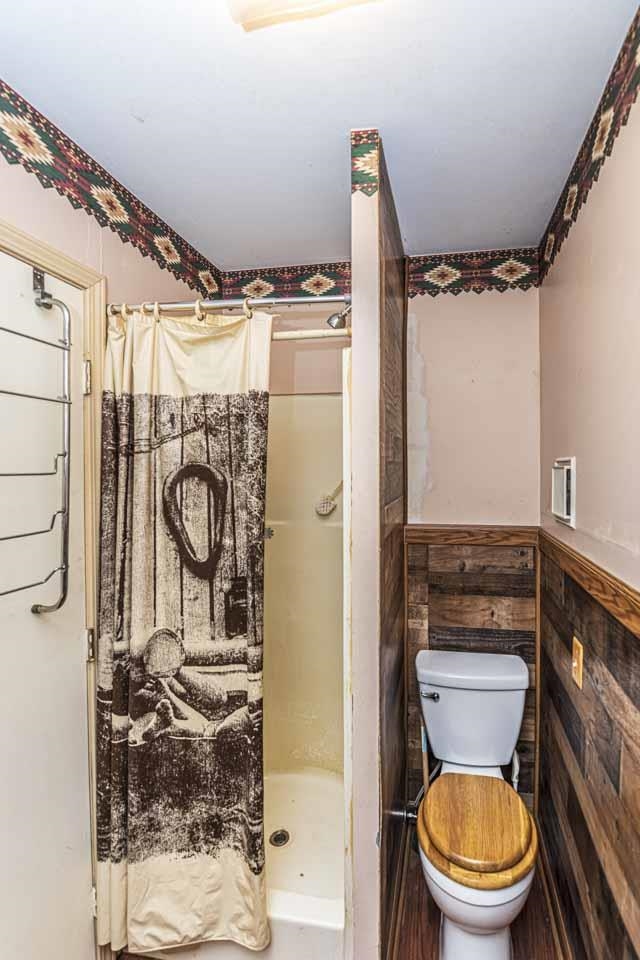 643 Fore Lane Mason, TN 38049 - Photo 23 of 40 a bathroom with a toilet and a shower