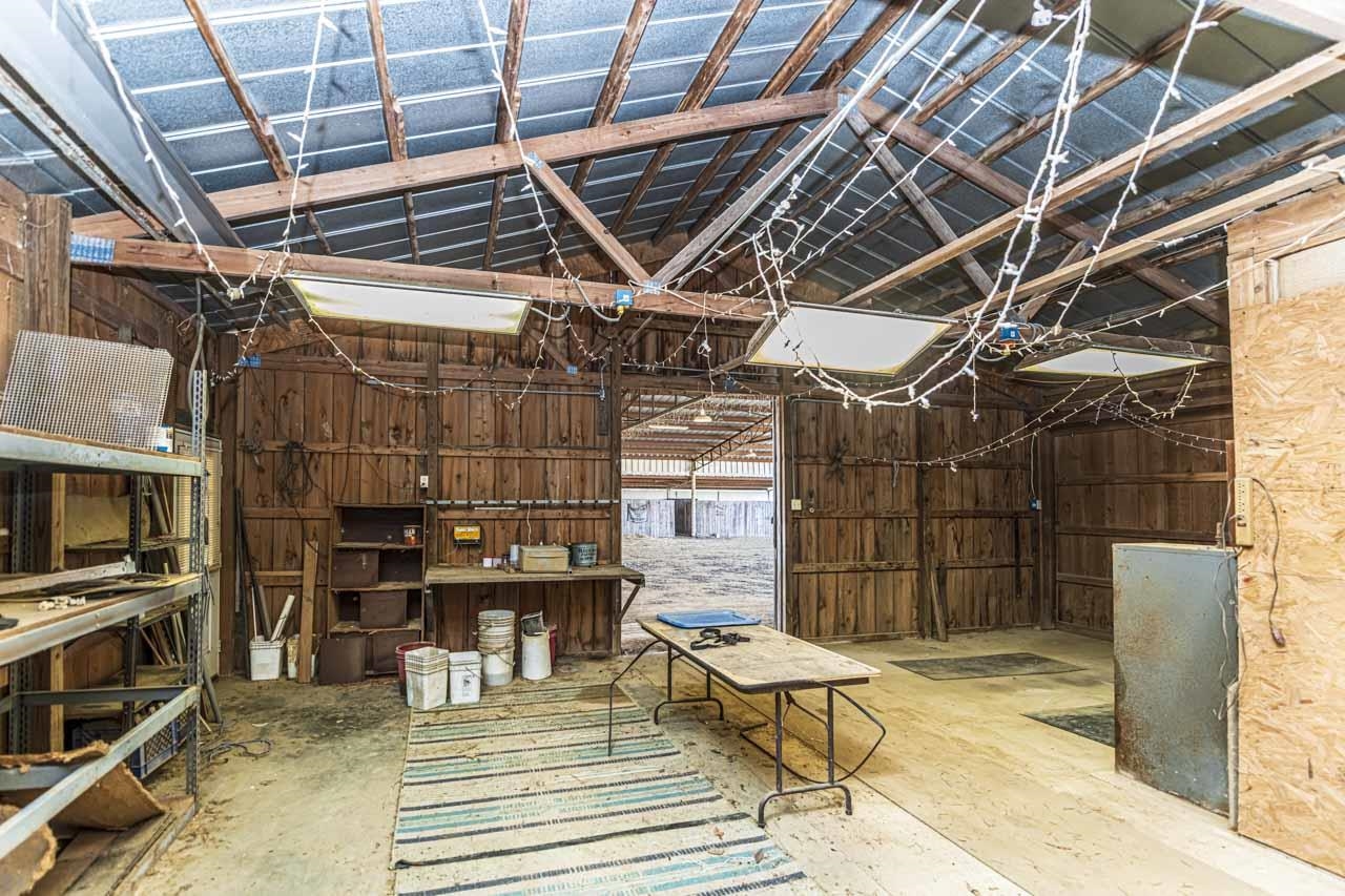 643 Fore Lane Mason, TN 38049 - Photo 30 of 40 a view of a garage with wooden wall