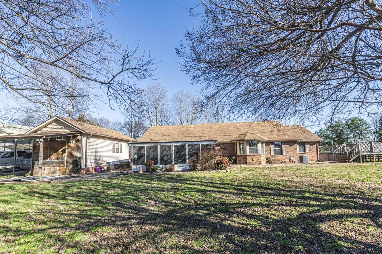 643 Fore Lane Mason, TN 38049 - Photo 3 of 40 a front view of a house with a garden