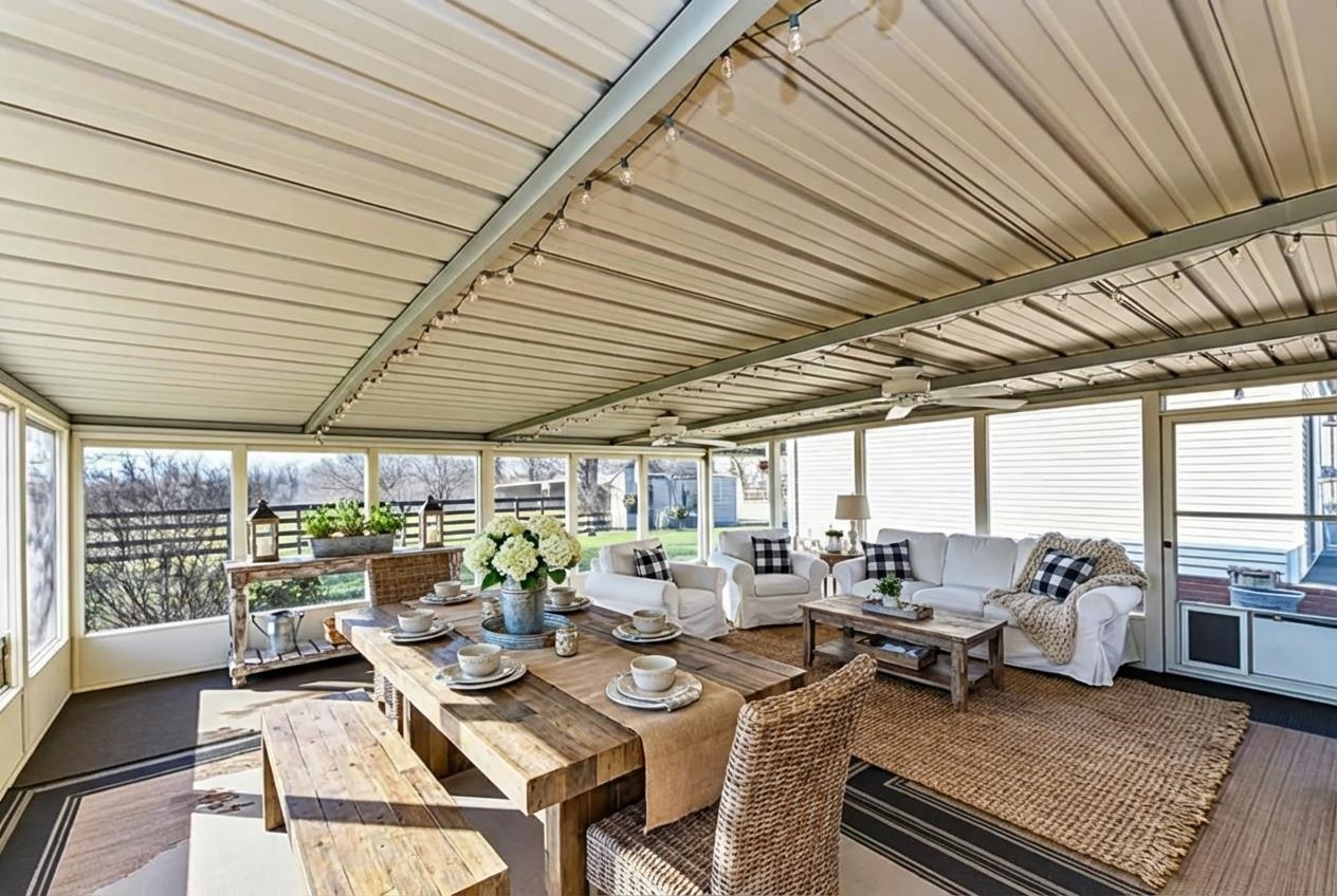 643 Fore Lane Mason, TN 38049 - Photo 37 of 40 Sunroom / solarium featuring healthy amount of natural light, an outdoor living space, wooden ceiling, outdoor dining space, and wood finished floors