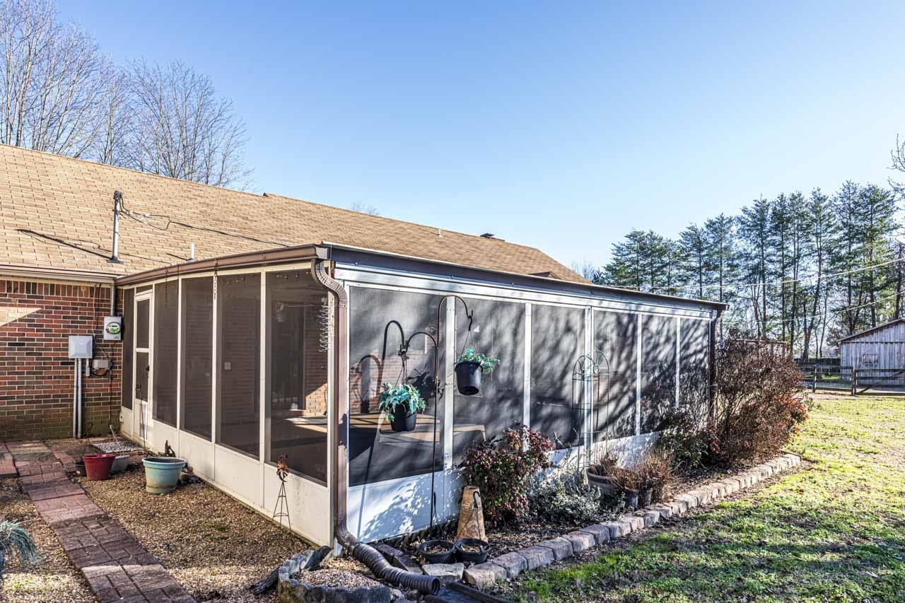 643 Fore Lane Mason, TN 38049 - Photo 38 of 40 a view of a backyard with plants and large trees