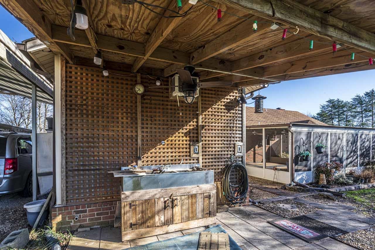 643 Fore Lane Mason, TN 38049 - Photo 39 of 40 a view of a storage room with wooden walls