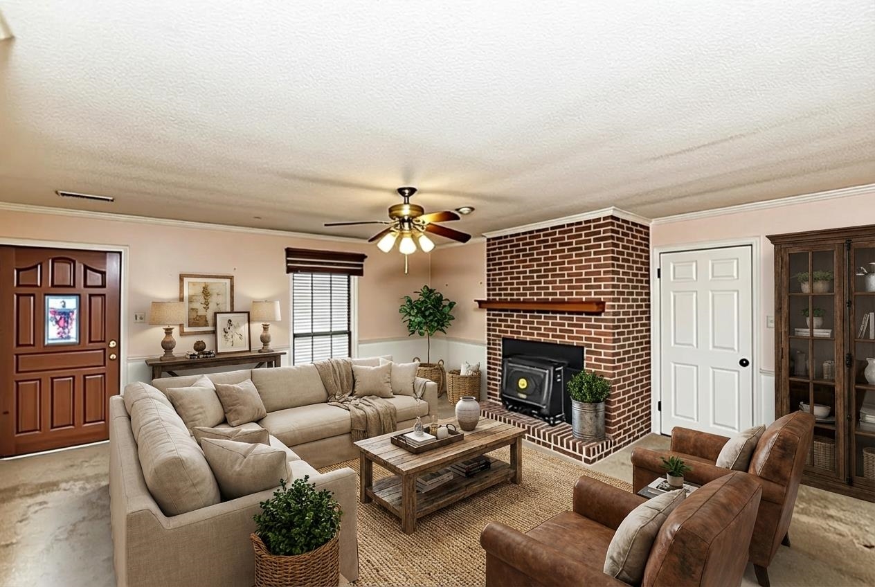 643 Fore Lane Mason, TN 38049 - Photo 5 of 40 a living room with furniture a fireplace and a flat screen tv