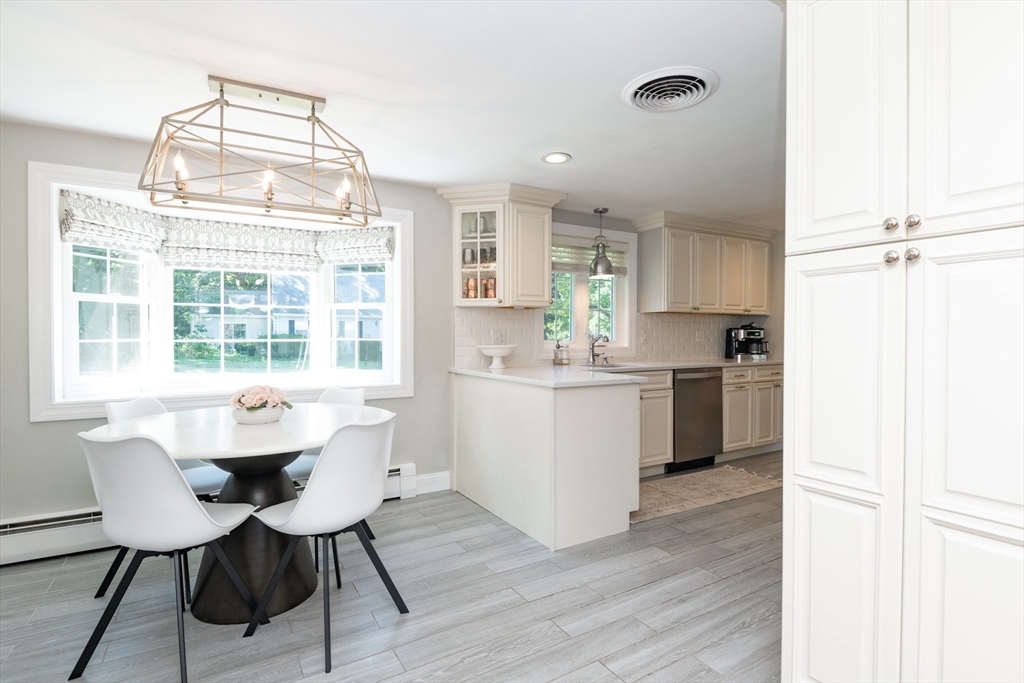 19 Longbow Road Lynnfield, MA 01940 - Photo 11 of 41 a kitchen with a sink and a refrigerator