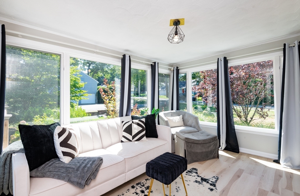 19 Longbow Road Lynnfield, MA 01940 - Photo 13 of 41 a living room with furniture and a large window