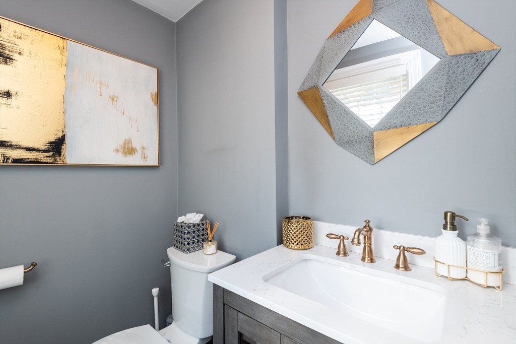 19 Longbow Road Lynnfield, MA 01940 - Photo 15 of 41 a bathroom with a toilet sink and mirror